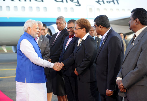 Modi being received on his arrival, at Nausori International Airport