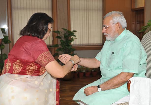 Women, children tie Rakhi on PM's wrist on Raksha Bandhan