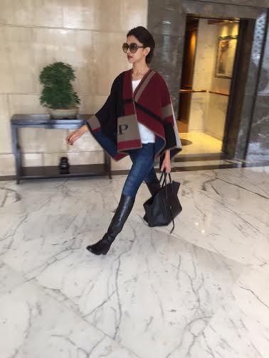 Deepika gets her initails on the Burberry Poncho