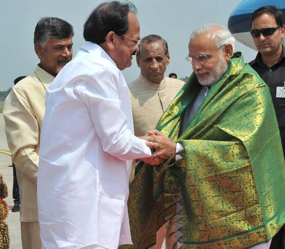  Narendra Modi being welcomed on arrival by the Chief Minister of Andhra Pradesh
