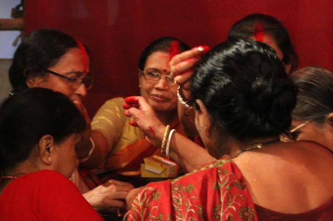 Women smear each other with sindoor on Vijaya Dasami