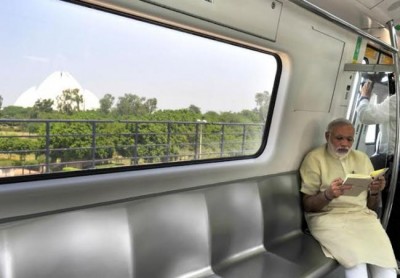 Narendra Modi travelling by the Delhi Metro