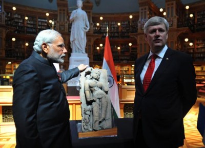 PM Harper returns 'Parrot Lady' to Modi