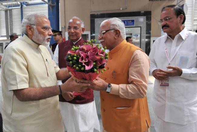 Narendra Modi travelling by the Delhi Metro