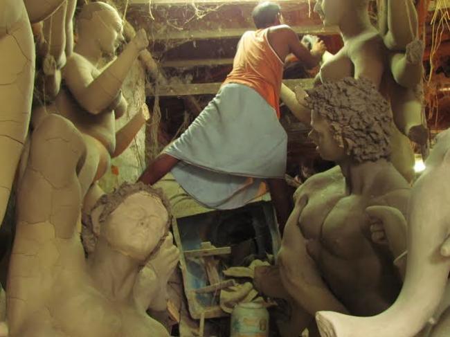 Artisans give final touches to Durga idols in Kumartoli