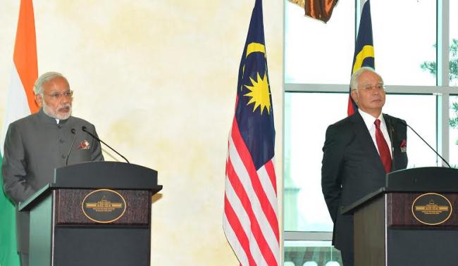 Narendra Modi being received by the Prime Minister of Malaysia, Mr. Najib Razak