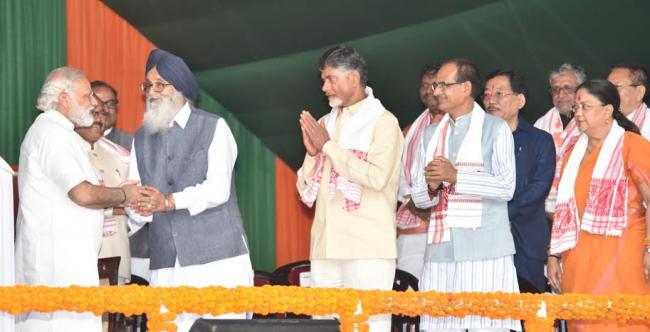 Narendra Modi being received by the Governor of Assam