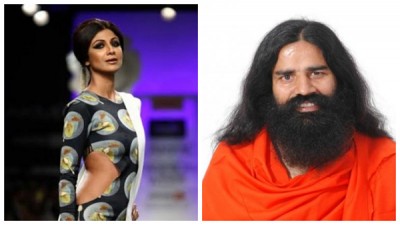 Shilpa Shetty presents her book to Baba Ramdev