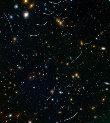 Hubble sees nearby asteroids photobombing distant galaxies
