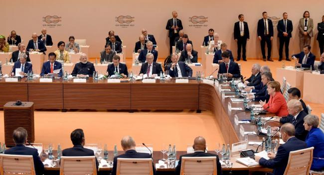 Narendra Modi being welcomed by the German Chancellor