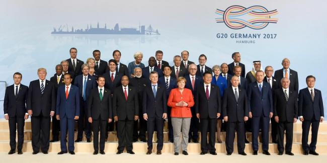 Narendra Modi being welcomed by the German Chancellor