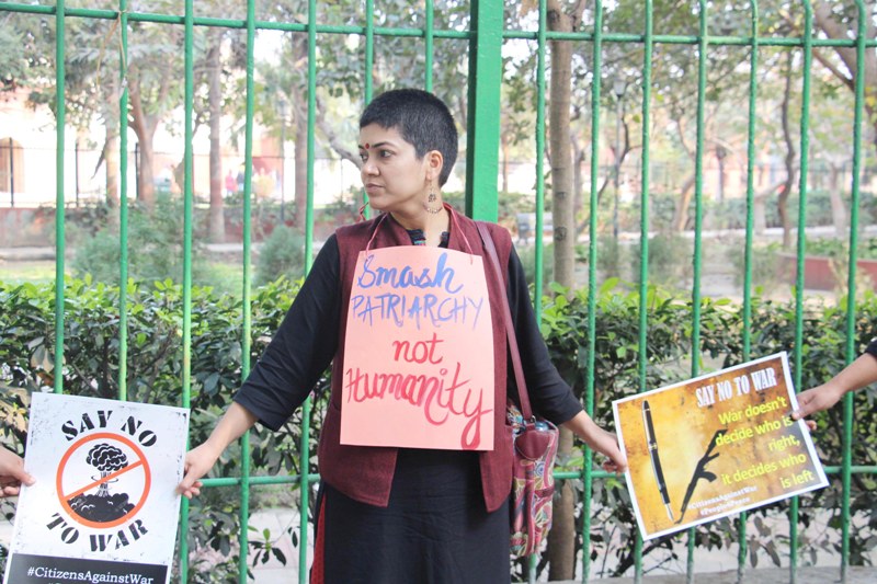 Members of Citizen Against War form human chain for peace