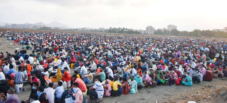 Migrants gather for medical check before boarding in Mumbai