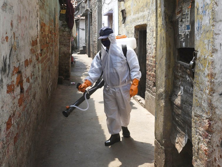 People queue up in front of pharmacies in Kolkata