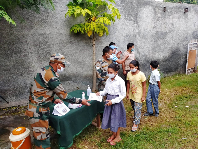 Jammu: Army distributing sanitizers and books among children