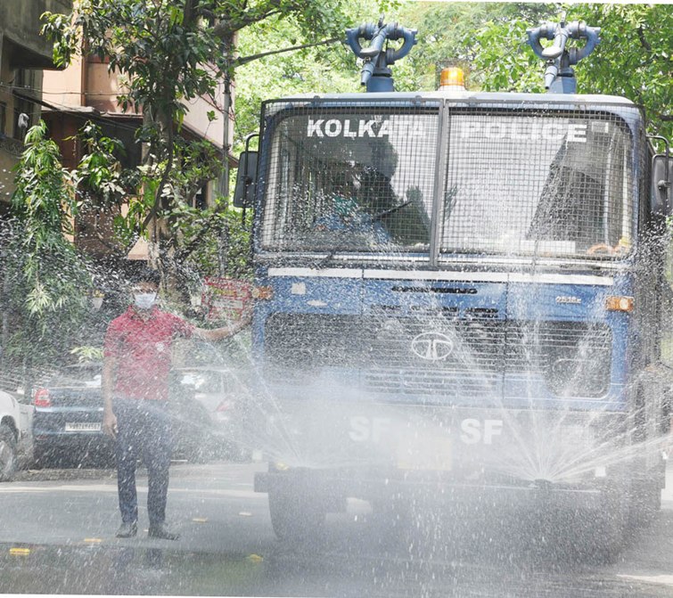 People queue up in front of pharmacies in Kolkata