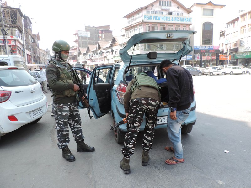 Srinagar: Security personnel checking vehicles at Lal Chowk