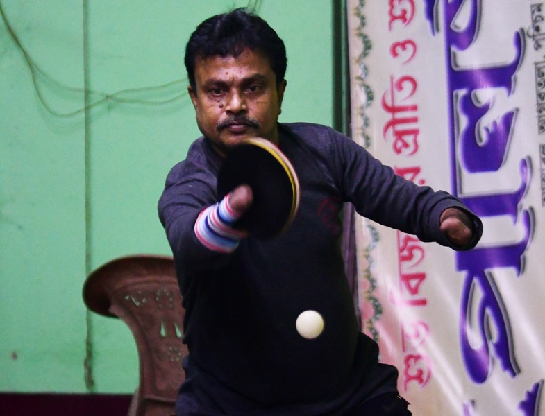 Disabled table tennis player Kajol Dey with his students on International Day of Persons with Disabilities in Agartala