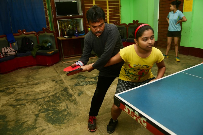 Disabled table tennis player Kajol Dey with his students on International Day of Persons with Disabilities in Agartala