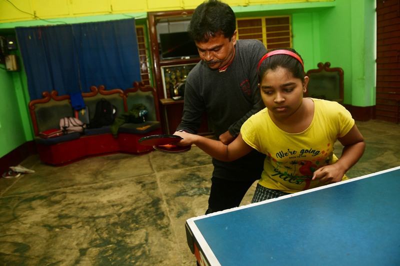 Disabled table tennis player Kajol Dey with his students on International Day of Persons with Disabilities in Agartala