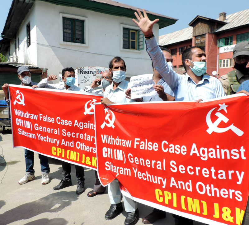 CPI(M) activists agitate demanding withdrawal of cases against party General Secretary Sitaram Yechury