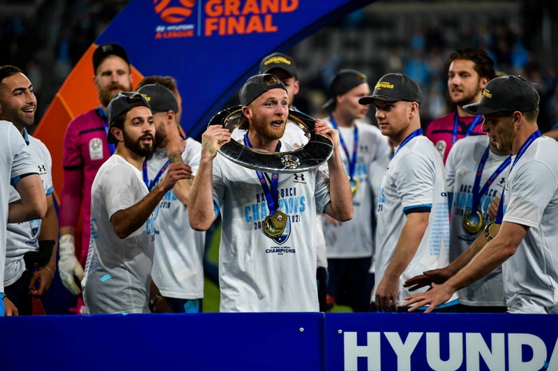 Players of Sydney FC celebrate during the awarding ceremony for A-League