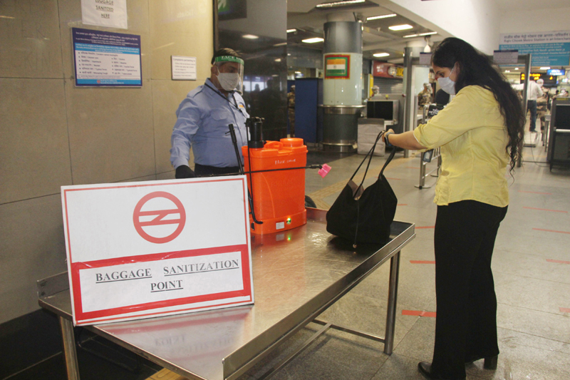 DMRC workers sanitizing Rajiv Chowk Metro Station ahead of resumption of metro services