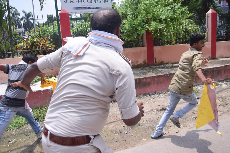 Police taking Jan Adhikar Party activists into custody in Patna as they demonstrate against Bihar flood situation