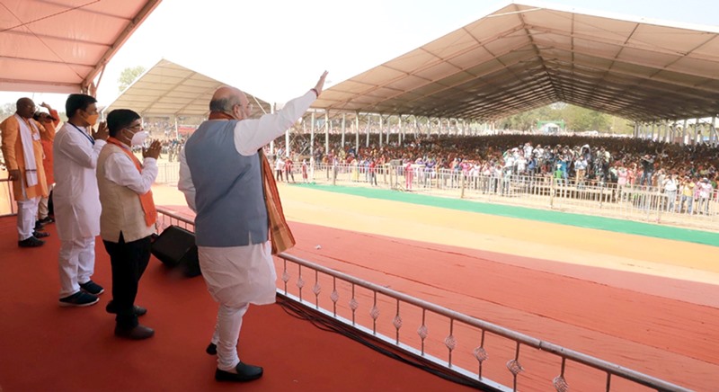 Amit Shah waves at the crowd in election rally in West Bengal