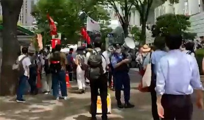 Protest against Olympic Games occurs in Tokyo near stadium during opening ceremony