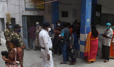 Voters waiting in queue at Thakurpukur polling station in Kolkata during Bengal Assembly Elections