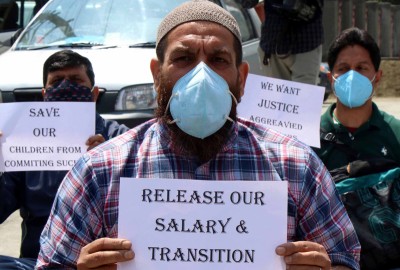 JK Employees Joint Action Committee members demonstrate in Srinagar