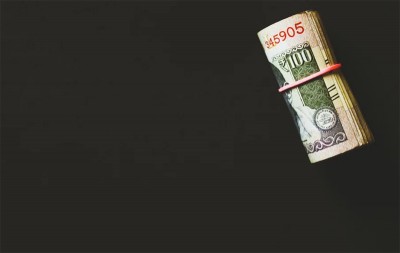 Rupee up by 12 paise against USD