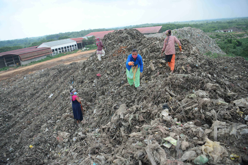 Agartala: Ragpickers collect recyclable materials from garbage dump