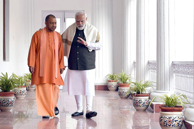 PM Modi interacts with Yogi Adityanath in Raj Bhavan corridor