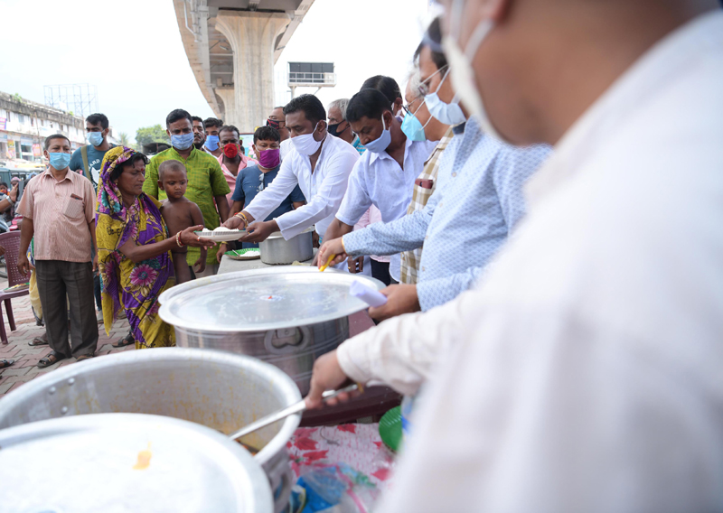 People waiting in queue for food in Agartala