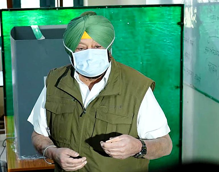 Punjab polls: People wait in queue to cast their votes