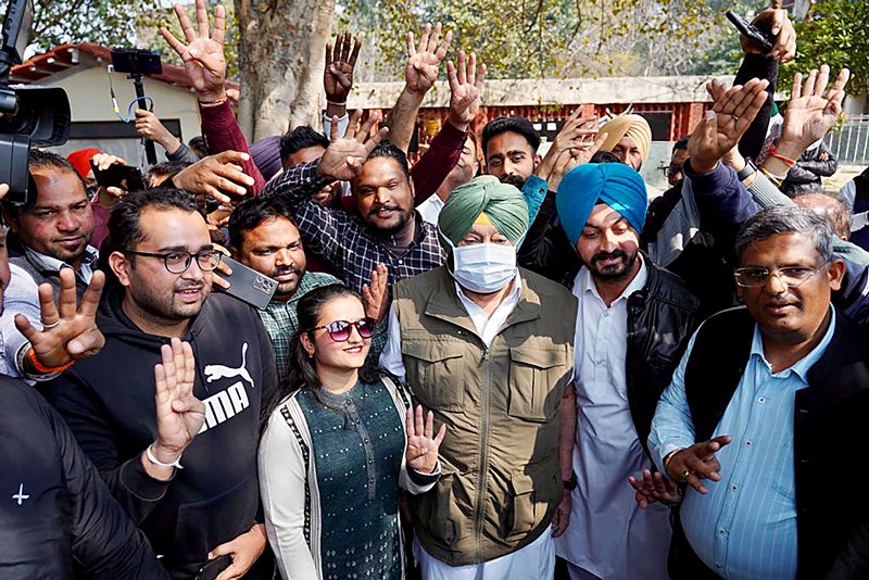 Punjab polls: People wait in queue to cast their votes