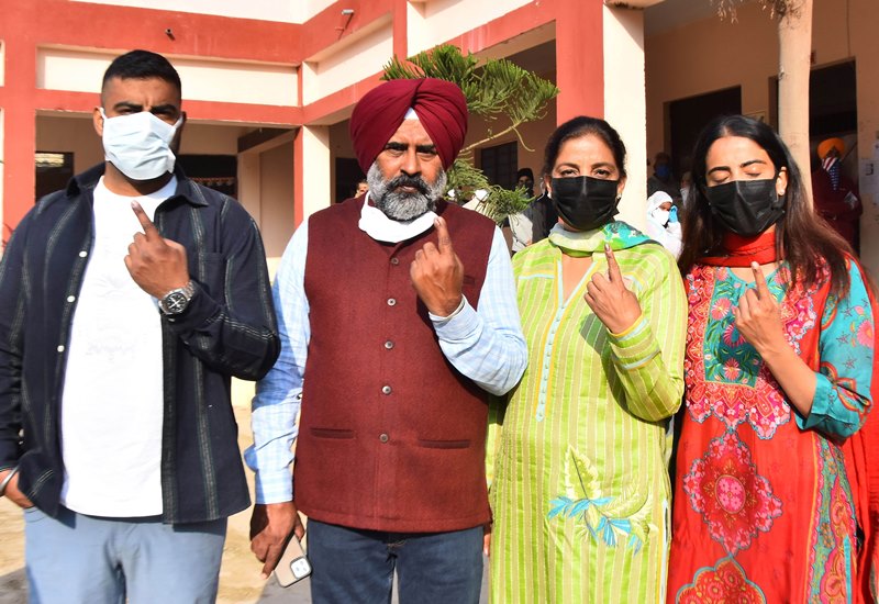 Punjab polls: People wait in queue to cast their votes