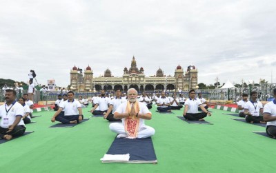 Yoga brings peace to our society, says Narendra Modi as he participates in Mass Yoga Demonstration at Mysore Palace ground