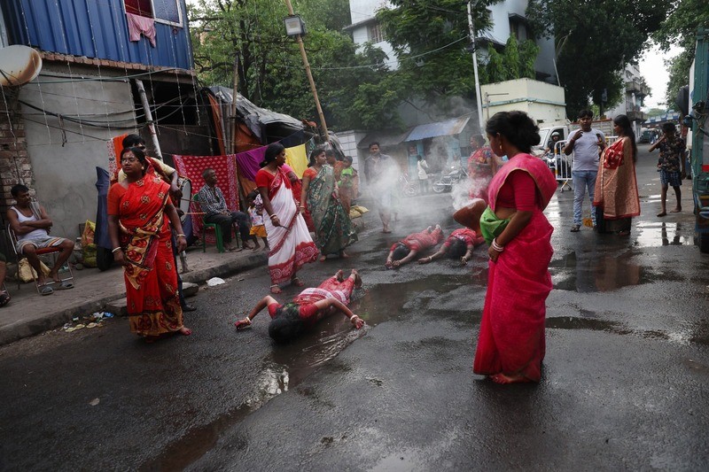 In Images: Devotees worship Goddess Sheetala with fire rituals in Kolkata