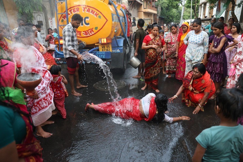 In Images: Devotees worship Goddess Sheetala with fire rituals in Kolkata
