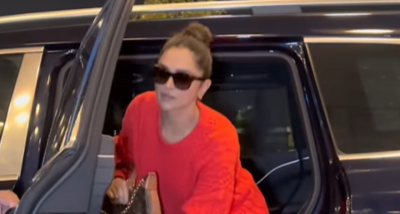 Deepika Padukone aces airport look in red sweater and denims as she jets off to attend Louis Vuitton event