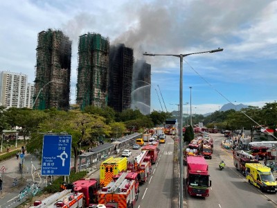 Hong Kong high-rise blaze death toll climbs to 128, officials warn could rise further