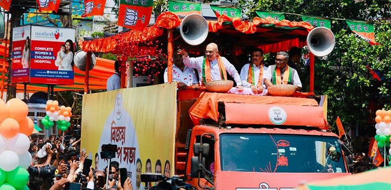 In Images: Amit Shah holds roadshow for BJP candidates in Kolkata