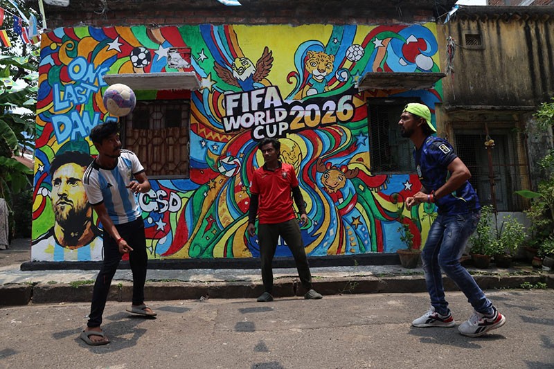 In Images: Children in Kolkata play beneath a giant World Cup masterpiece