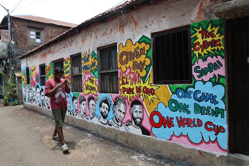 In Images: Children in Kolkata play beneath a giant World Cup masterpiece