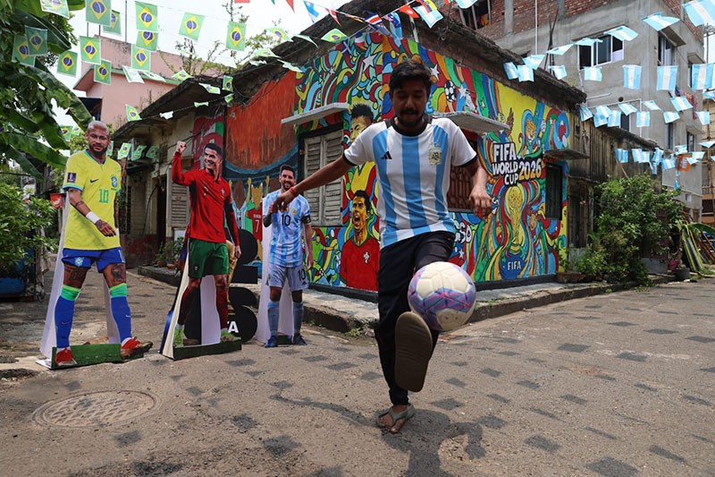 In Images: Children in Kolkata play beneath a giant World Cup masterpiece