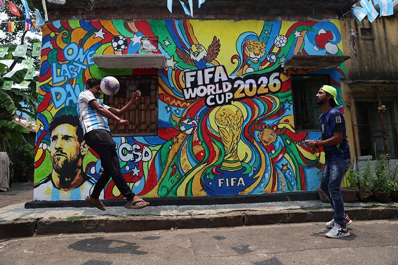 In Images: Children in Kolkata play beneath a giant World Cup masterpiece