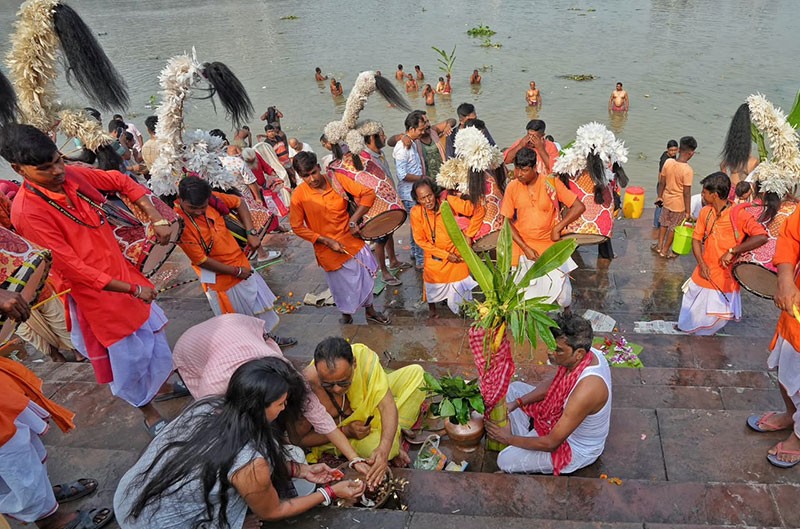 In Images: Kala Bou snan performed at Kolkata ghats on Durga Puja Maha Saptami